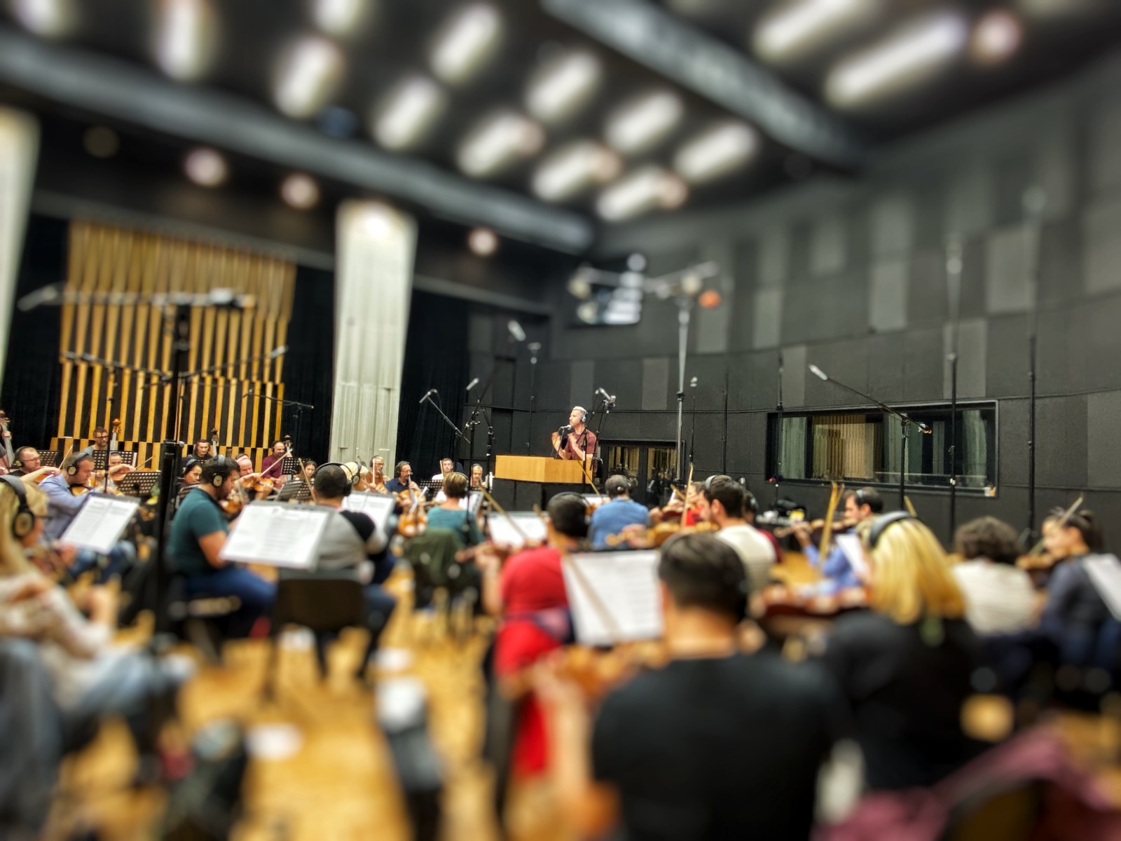 Evan Monheit conducting the orchestra for Phantom Bridge